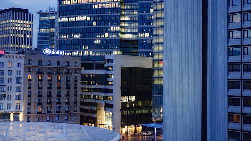 office building lighted city high rise buildings at dusk city